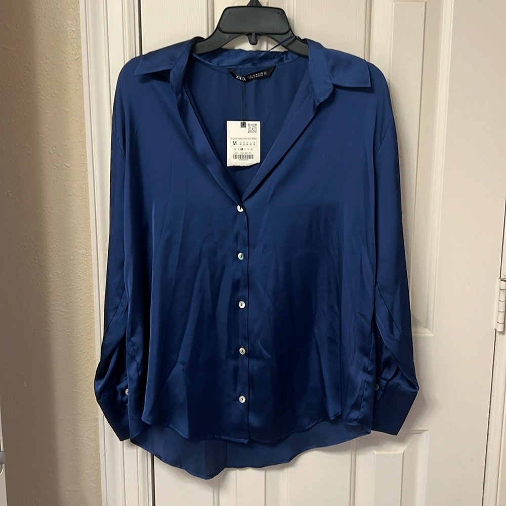 Zara women’s long sleeve blue silk like blouse. Size medium.